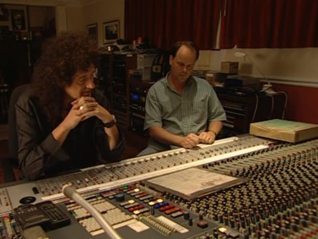 Brian May at a mixing desk reviewing Bohemian Rhapsody
