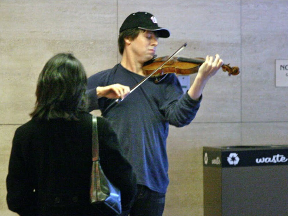 Joshua Bell playing the violin inside L’Enfant Plaza Metro entrance in Washington DC on the Friday 12 January 2007